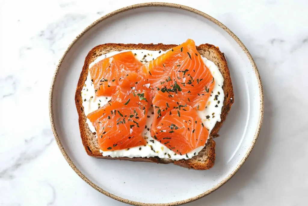 Smoked salmon bagel with cream cheese, red onion, and capers.