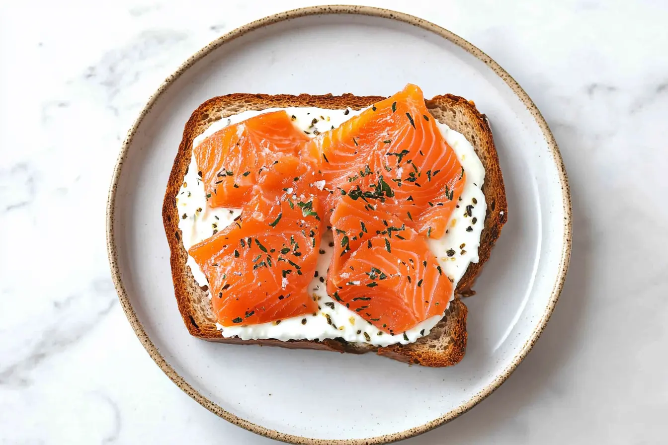 Smoked salmon bagel with cream cheese, red onion, and capers.