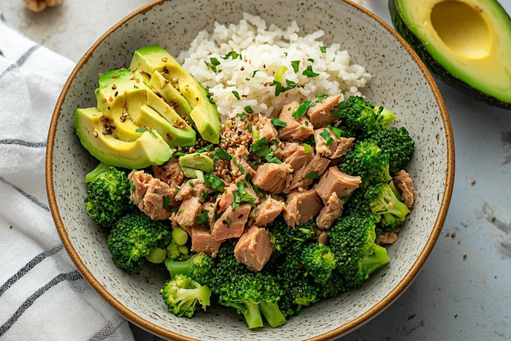 Broccoli Avocado Tuna Bowls packed in meal prep containers for easy, healthy lunches.