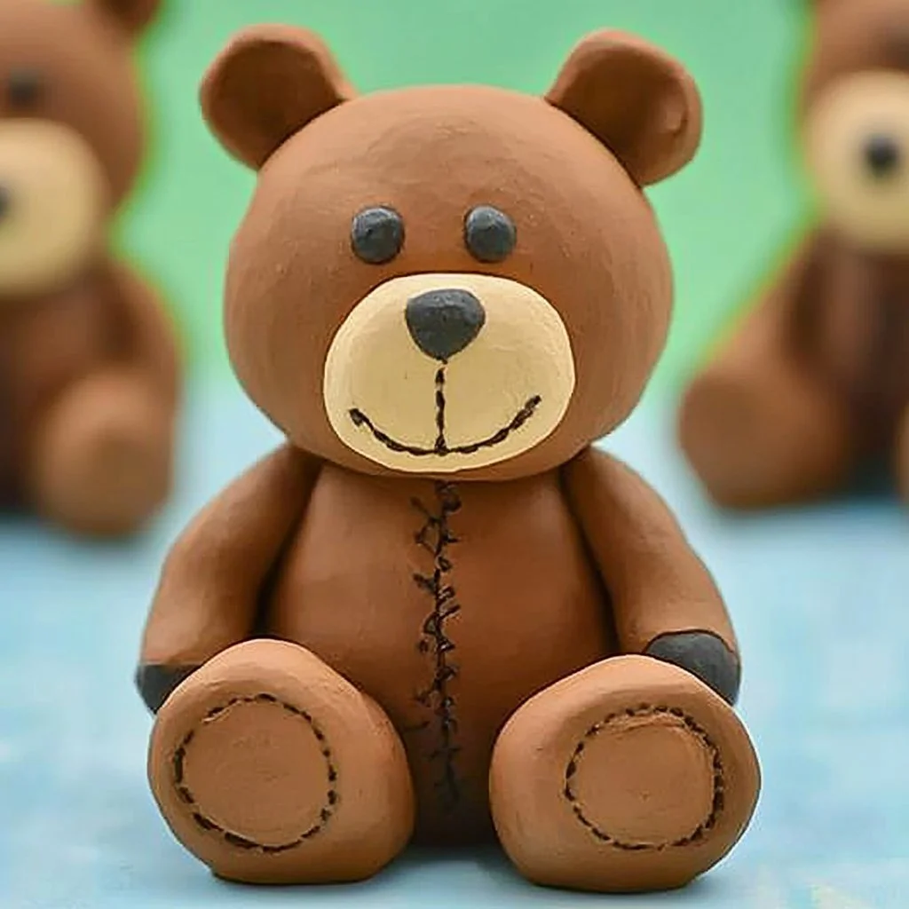 Creative Clay Bear craft project with colorful materials and tools.