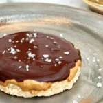 Peanut butter chocolate rice cakes topped with creamy peanut butter and melted chocolate.