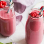 Raspberry Green Tea Smoothie with fresh raspberries and yogurt in a glass