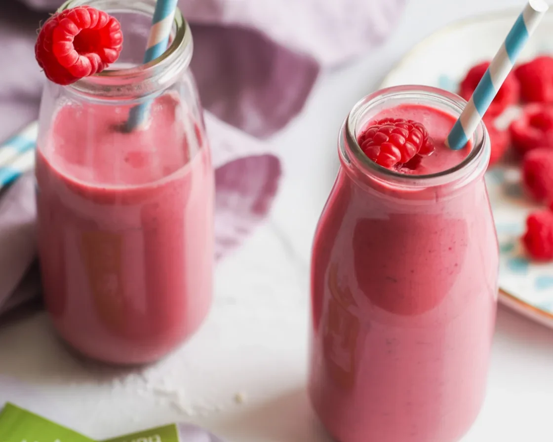 Raspberry Green Tea Smoothie with fresh raspberries and yogurt in a glass