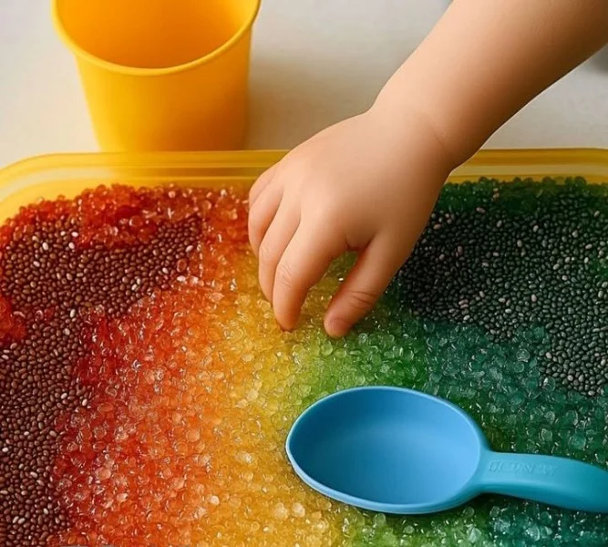 Chia seed sensory bin for children, promoting tactile play and learning.
