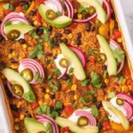 Delicious taquito casserole baked to perfection for fall gatherings.