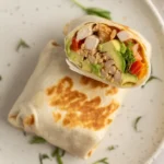 Healthy breakfast burrito packed with eggs, vegetables, and low-calorie ingredients.