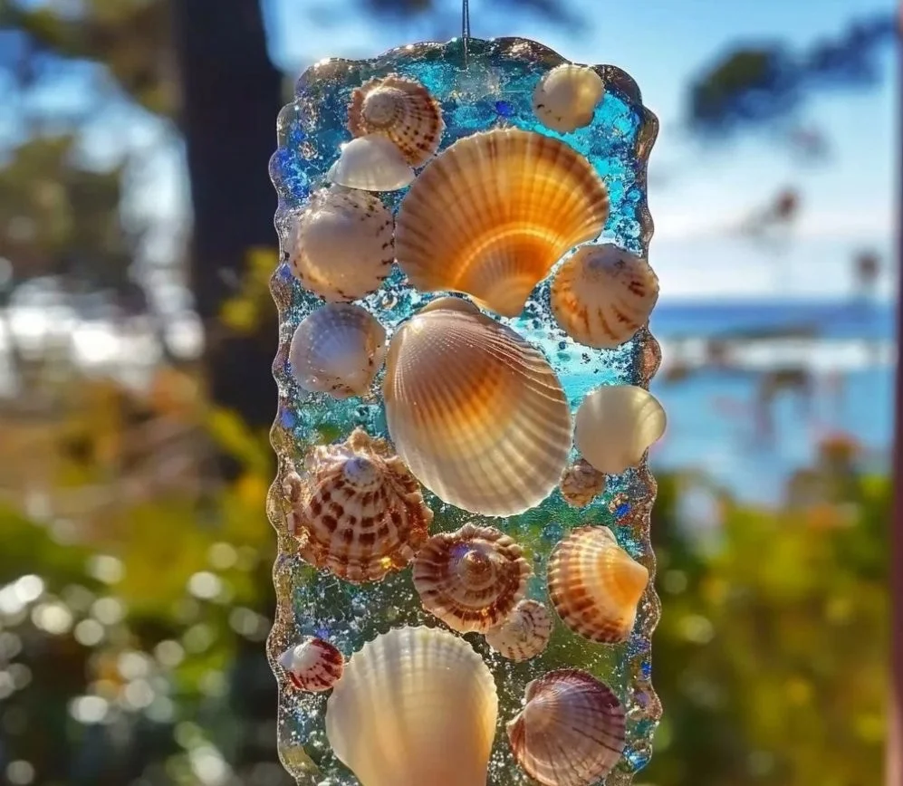 Ocean Magic Shell Suncatcher reflecting light in a beautiful home decor setting