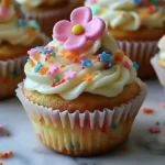 Delicious small batch vanilla sprinkle cupcakes with colorful toppings