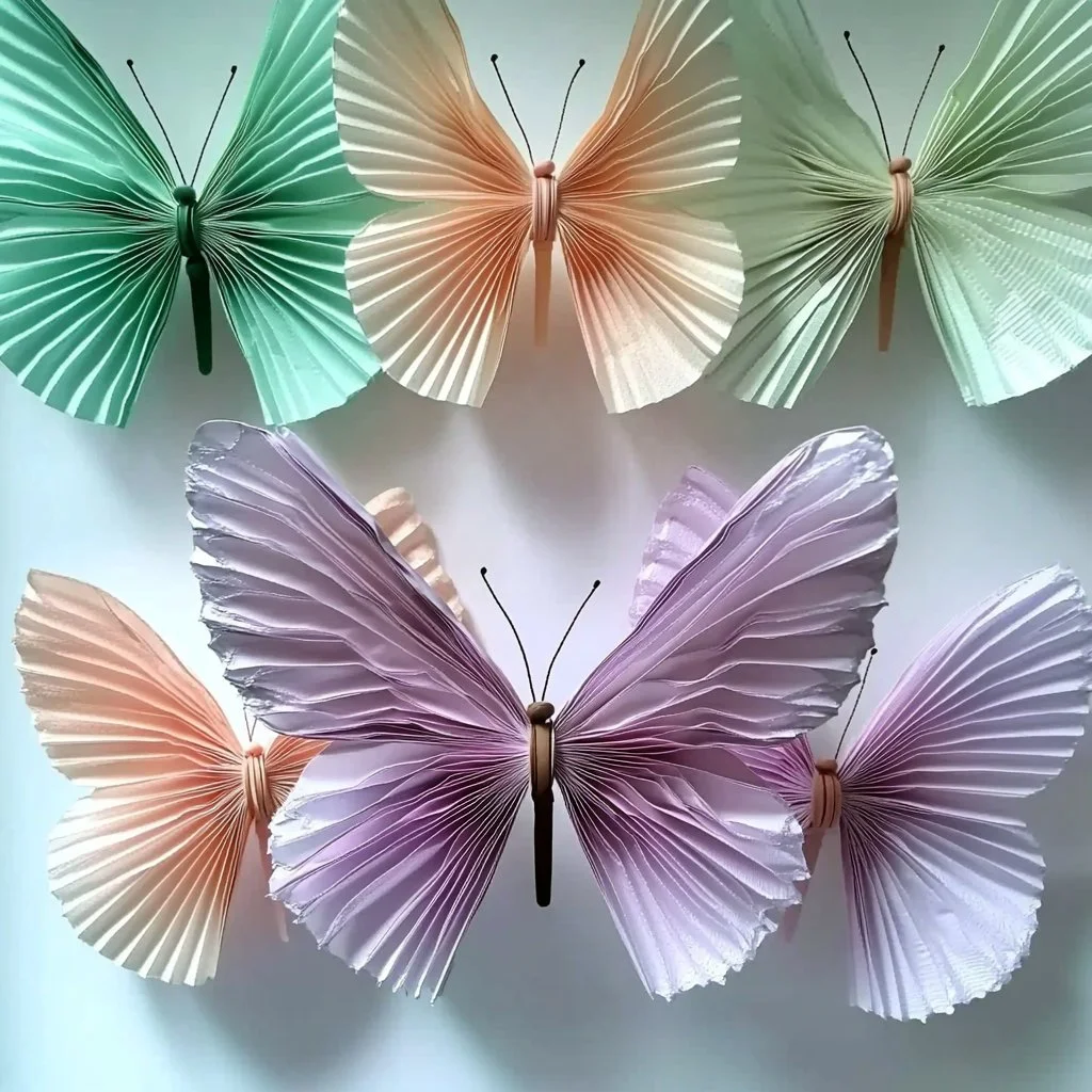 Colorful coffee filter butterflies crafted with DIY techniques and creativity.