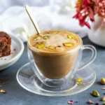 Creamy pistachio latte with espresso, milk, and pistachio syrup in a coffee cup