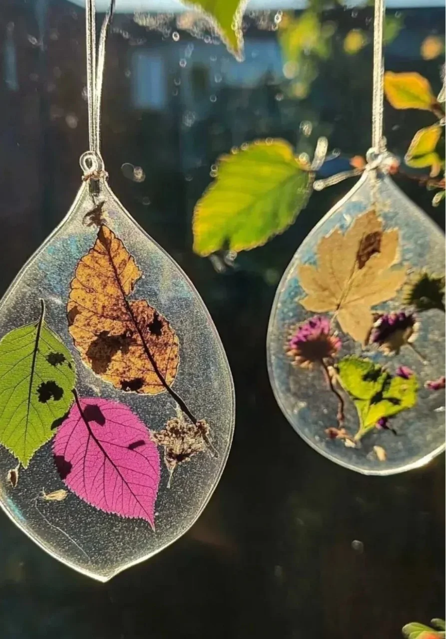 Colorful DIY Nature Suncatchers made from leaves and flowers