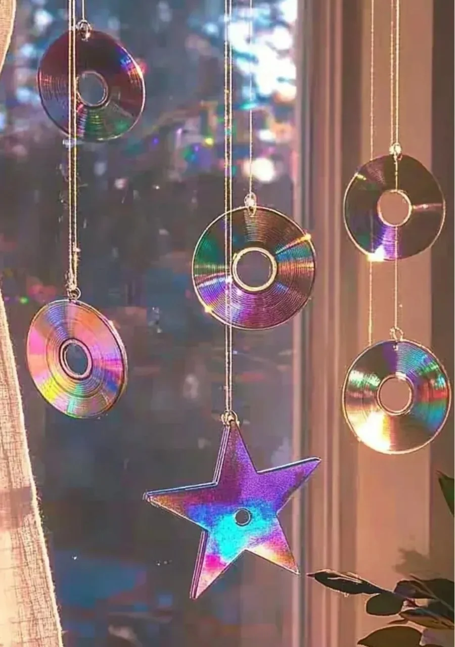 Colorful rainbow made from old CDs and glue, showcasing a fun upcycled craft.