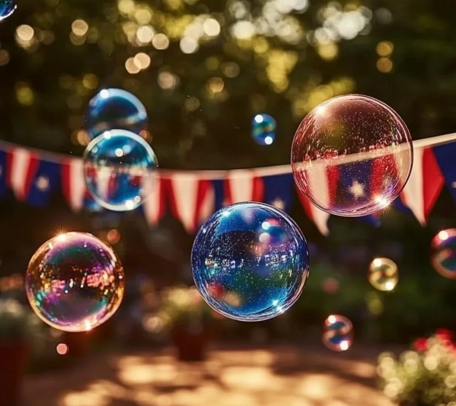 Children blowing bubbles during a Fourth of July celebration.