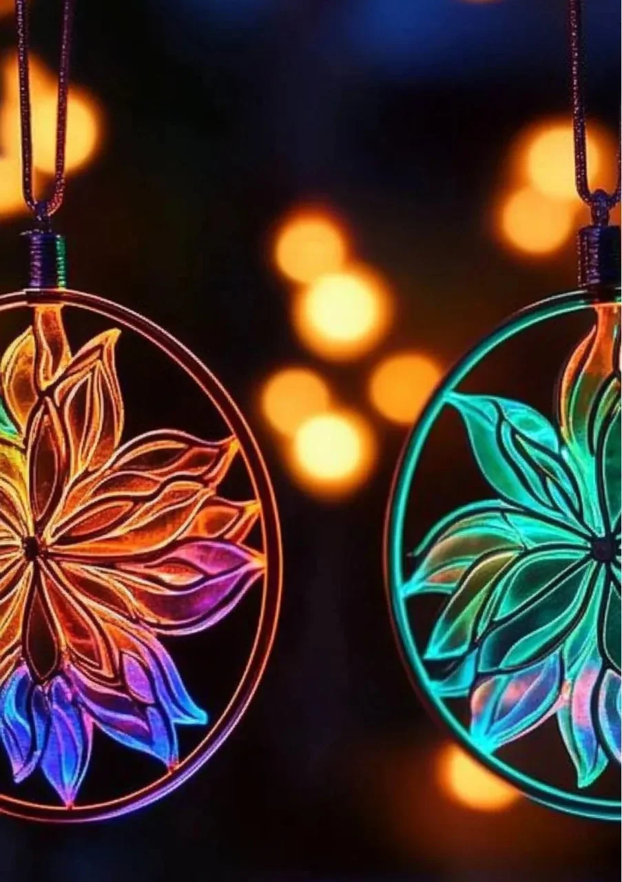 Glow-in-the-dark suncatchers illuminating a window with vibrant colors.