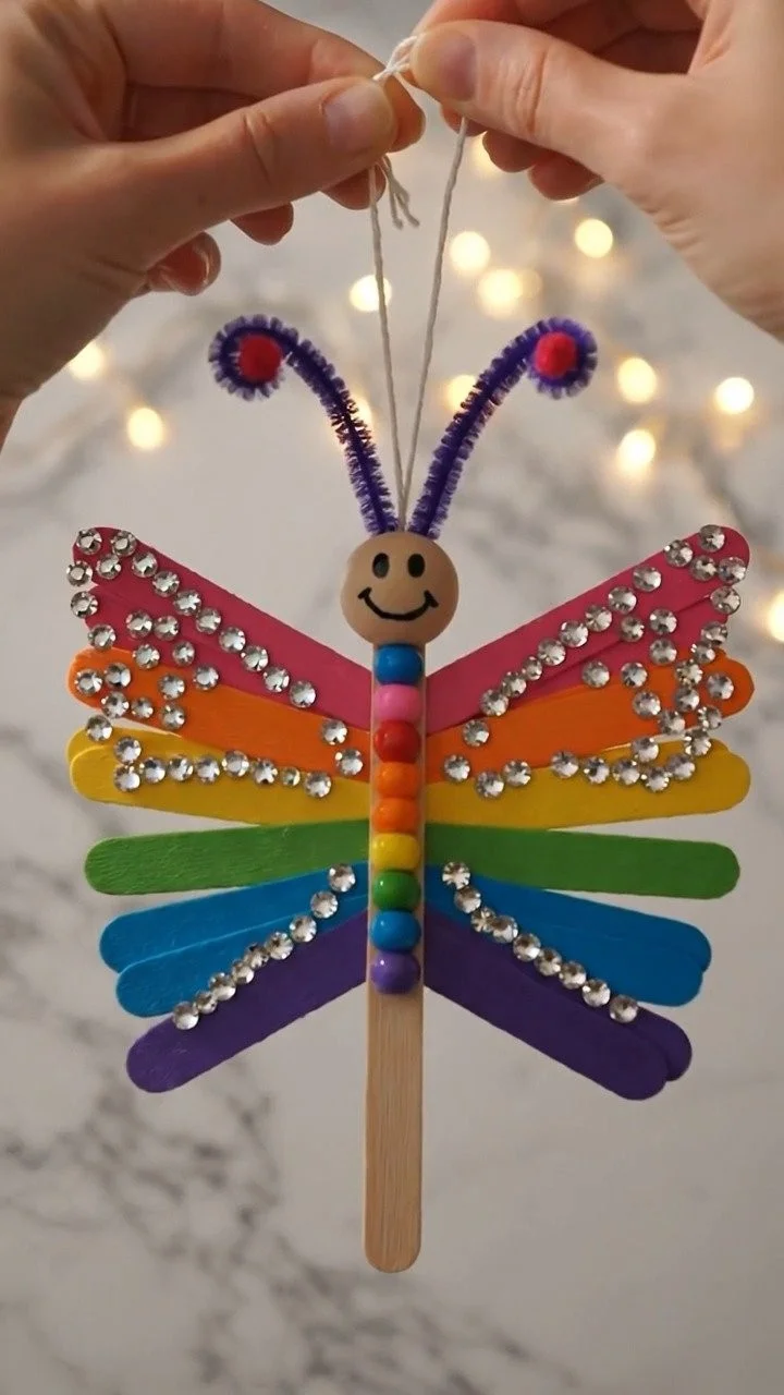Moving popsicle stick butterfly craft creates colorful fluttering butterflies with fun moving wings ✨ A creative kids DIY. Save this project! #ButterflyCraft #PopsicleStickCraft #KidsArt #CreativeKid 6 Moving popsicle stick butterfly craft creates colorful fluttering butterflies with fun moving wings ✨ A creative kids DIY. Save this project! #ButterflyCraft #PopsicleStickCraft #KidsArt #CreativeKid